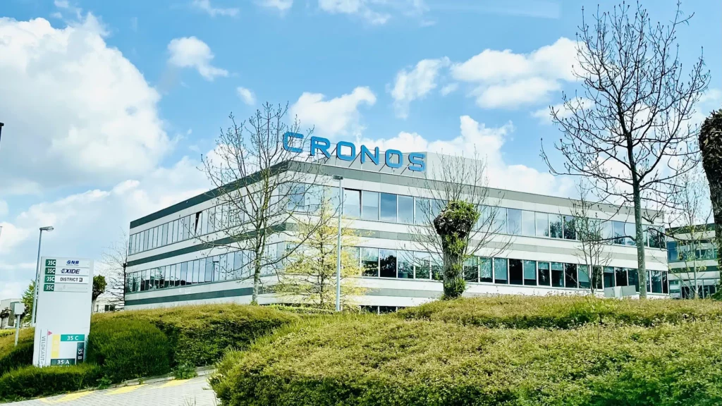 Office building with "CRONOS" sign, reflecting De Cronos Groep’s commitment to sustainability and innovation.